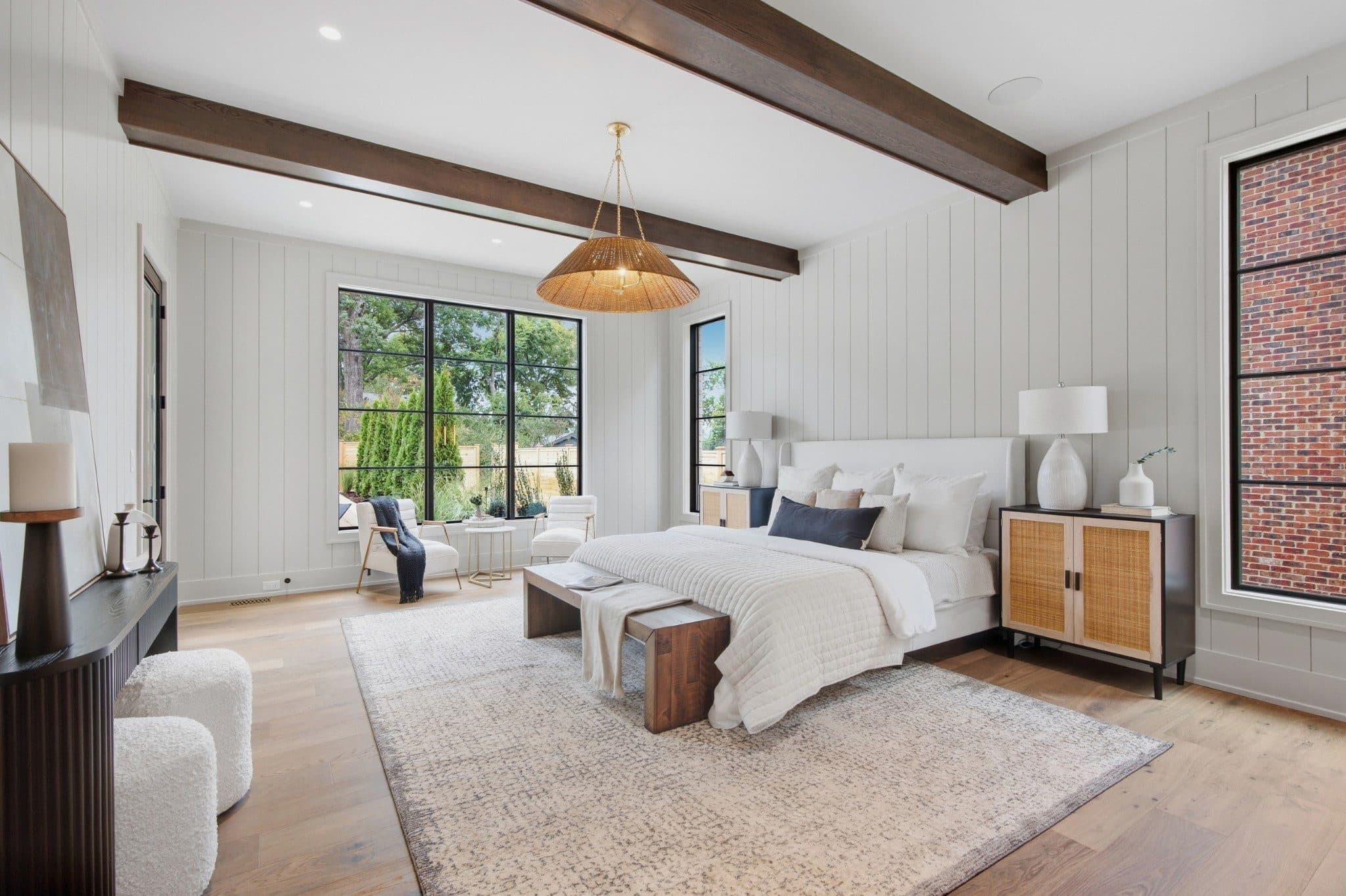 Primary bedroom with a beamed ceiling and black framed windows at 3720 Benham Ave, Green Hills Nashville