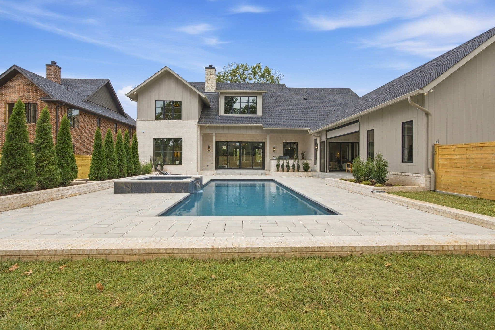 Heated pool and spa on a paver patio behind the home and attached pool house at 3720 Benham Ave, Green Hills Nashville