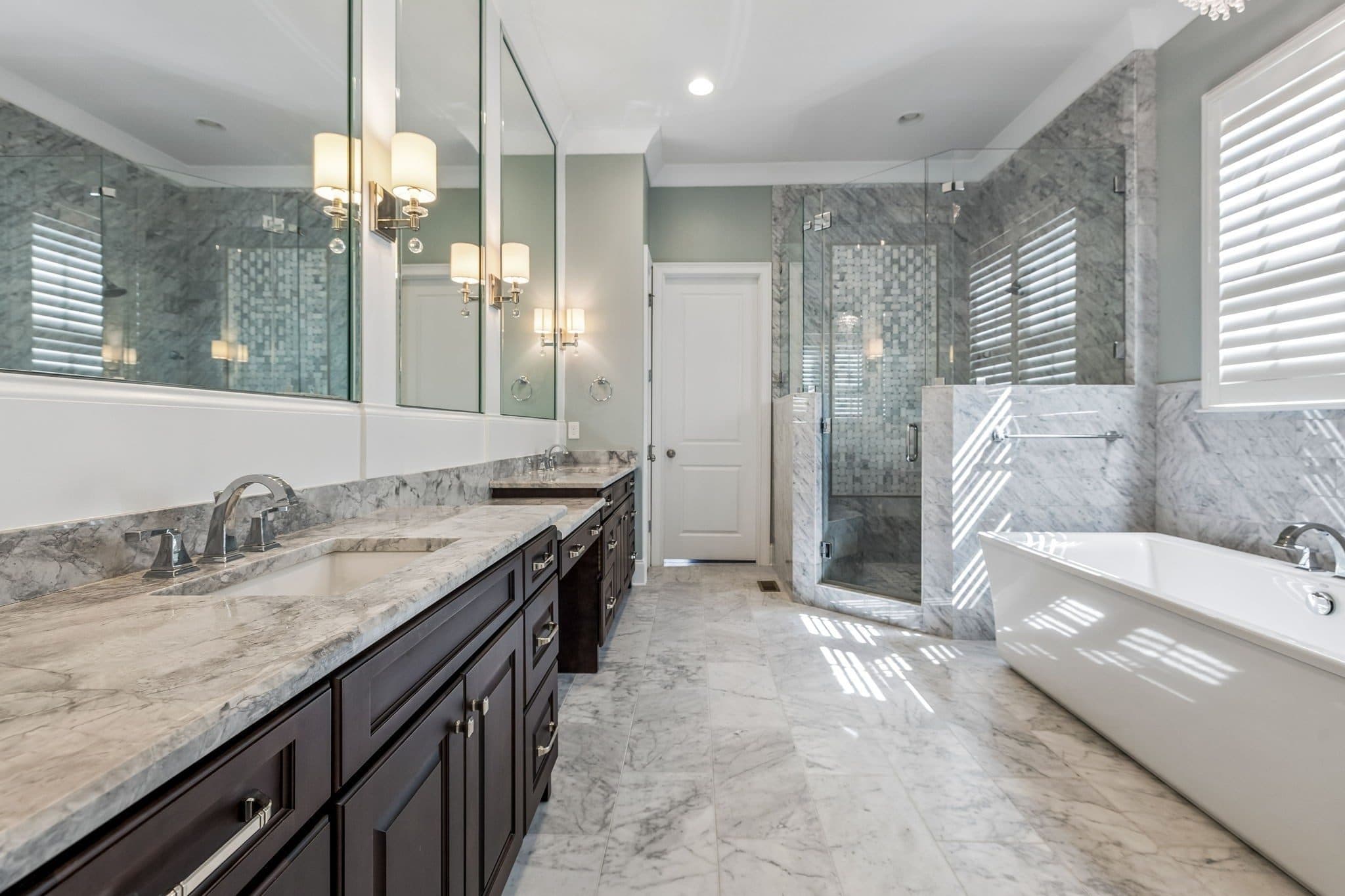 Spa bath with a freestanding soaking tub, a marble vanity, and a glass tiled shower at 4019 Vailwood Drive, Green Hills Nashville