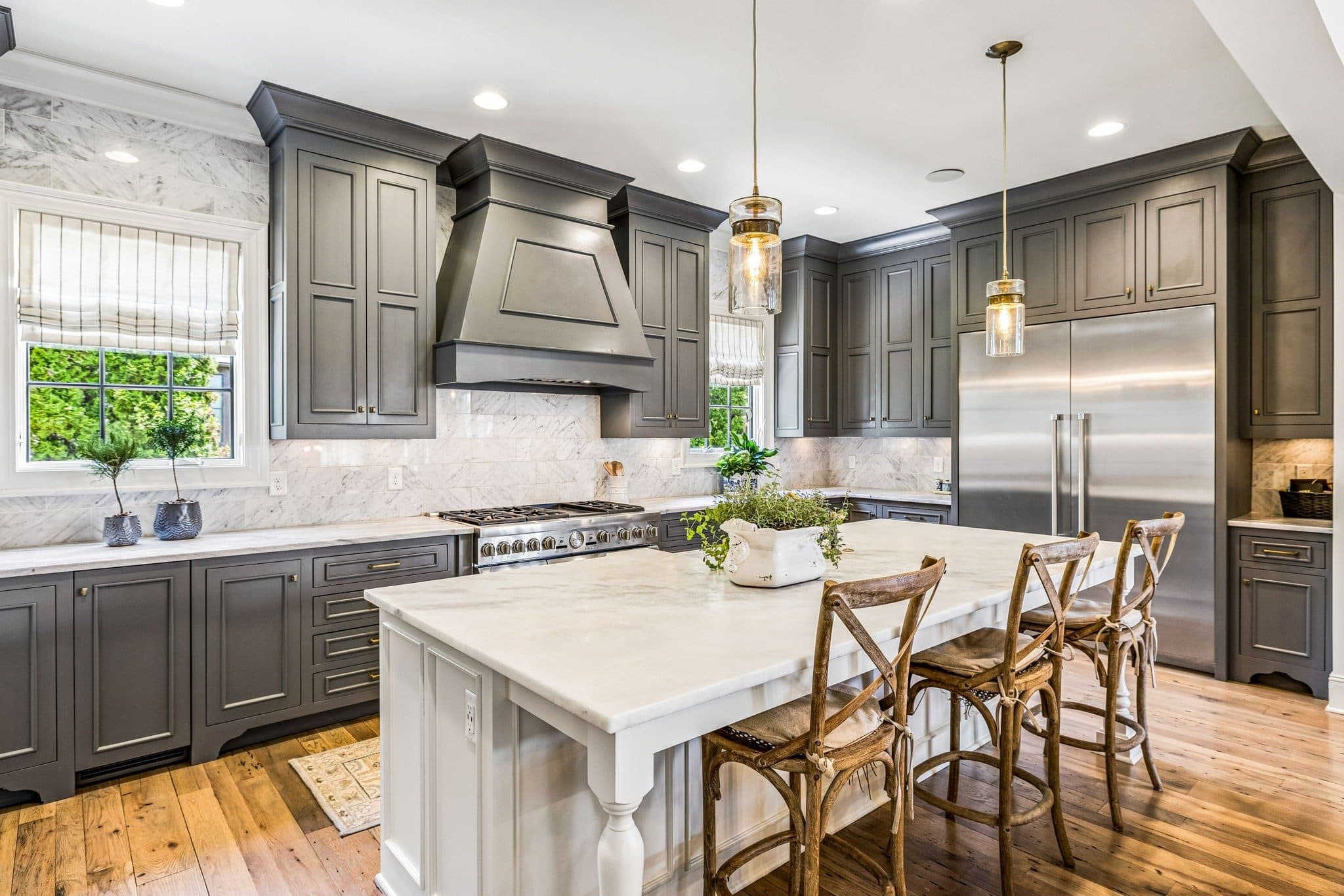 Kitchen with dark gray cabinetry, a marble topped island, and a stainless range at 3719 Woodmont Boulevard, Green Hills Nashville