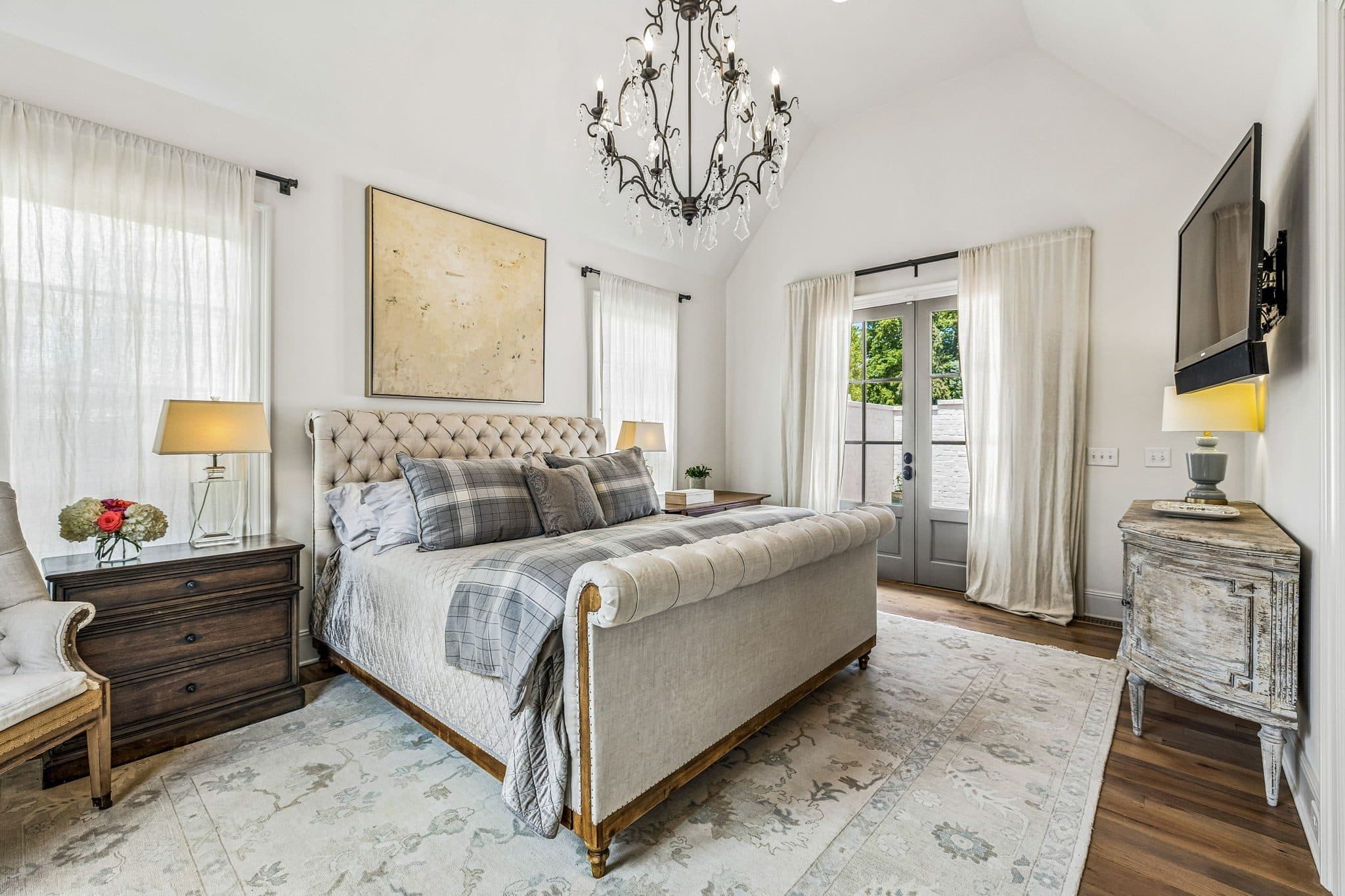 Primary bedroom with a vaulted ceiling, a sleigh bed, and French doors at 3719 Woodmont Boulevard, Green Hills Nashville